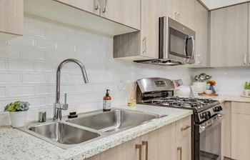 Chrome high-arc pull-out kitchen faucet